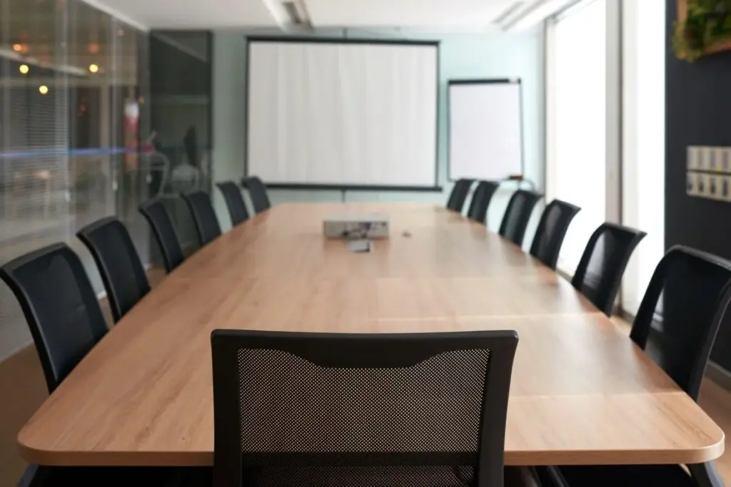A business room showcasing a modern office arrangement with a modern office table